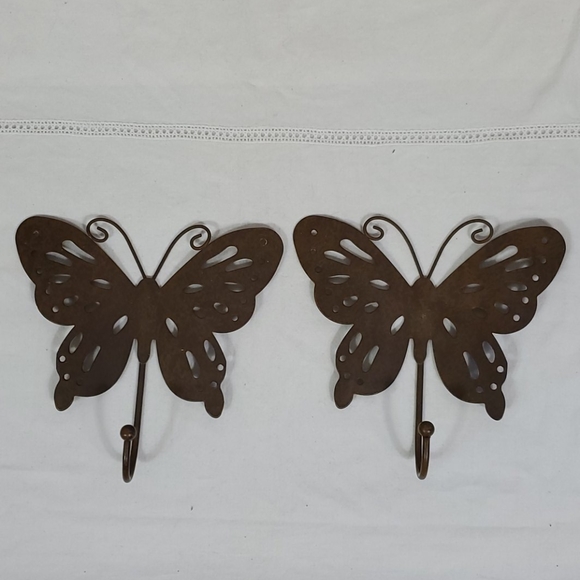 Two metal wall butterfly hooks